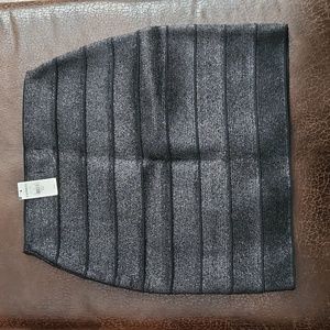 Express form fitting skirt, black with shimmer. Brand new size small.